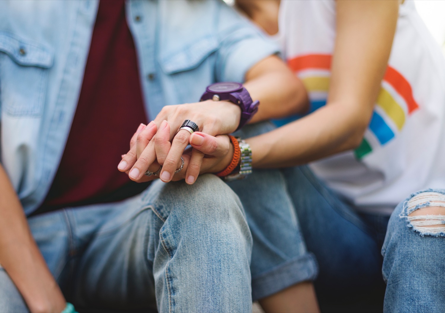 White LGBTQ couple holding hands