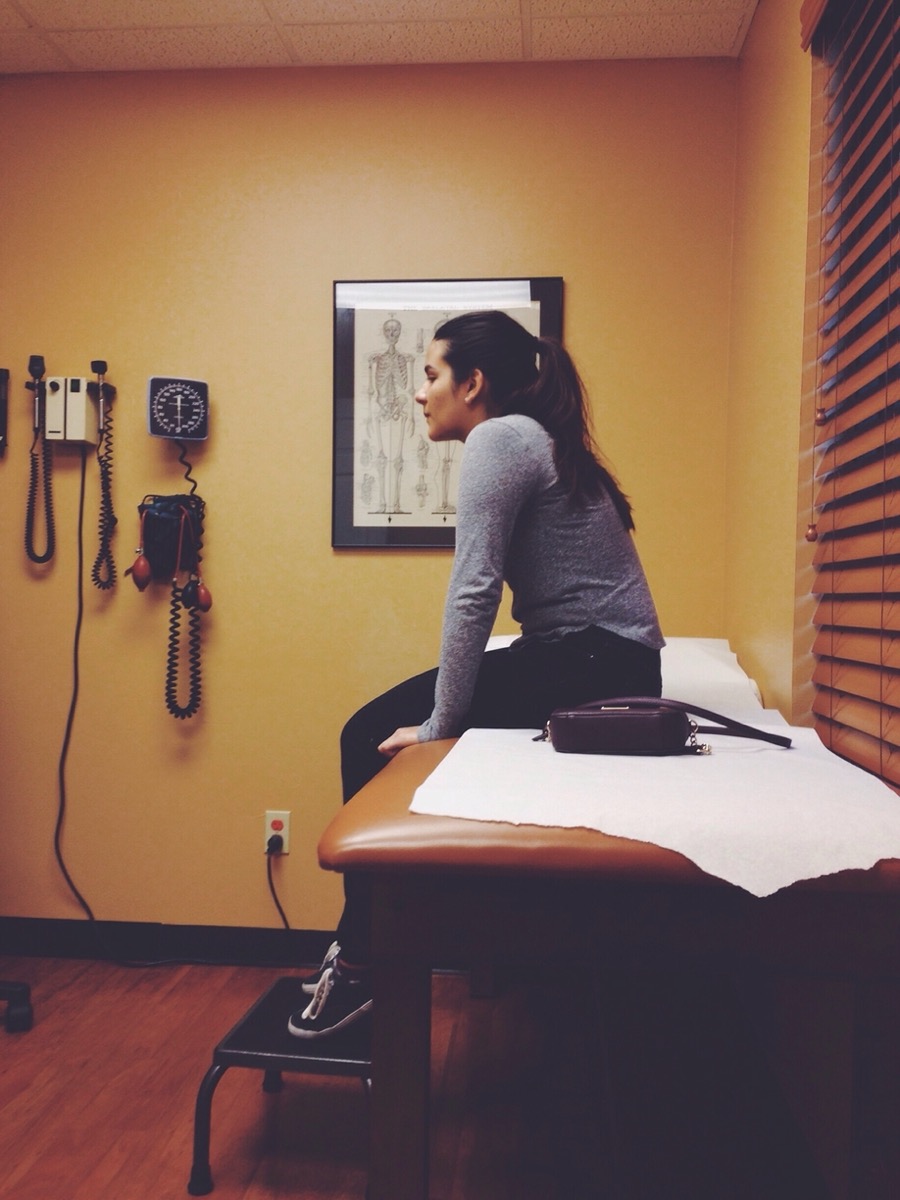 Girl sitting in doctor's office